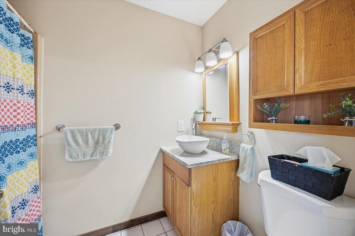 1518 Commissioners Road Mullica Hill, NJ 08062 - Photo 23 of 35 a bathroom with a sink and a mirror
