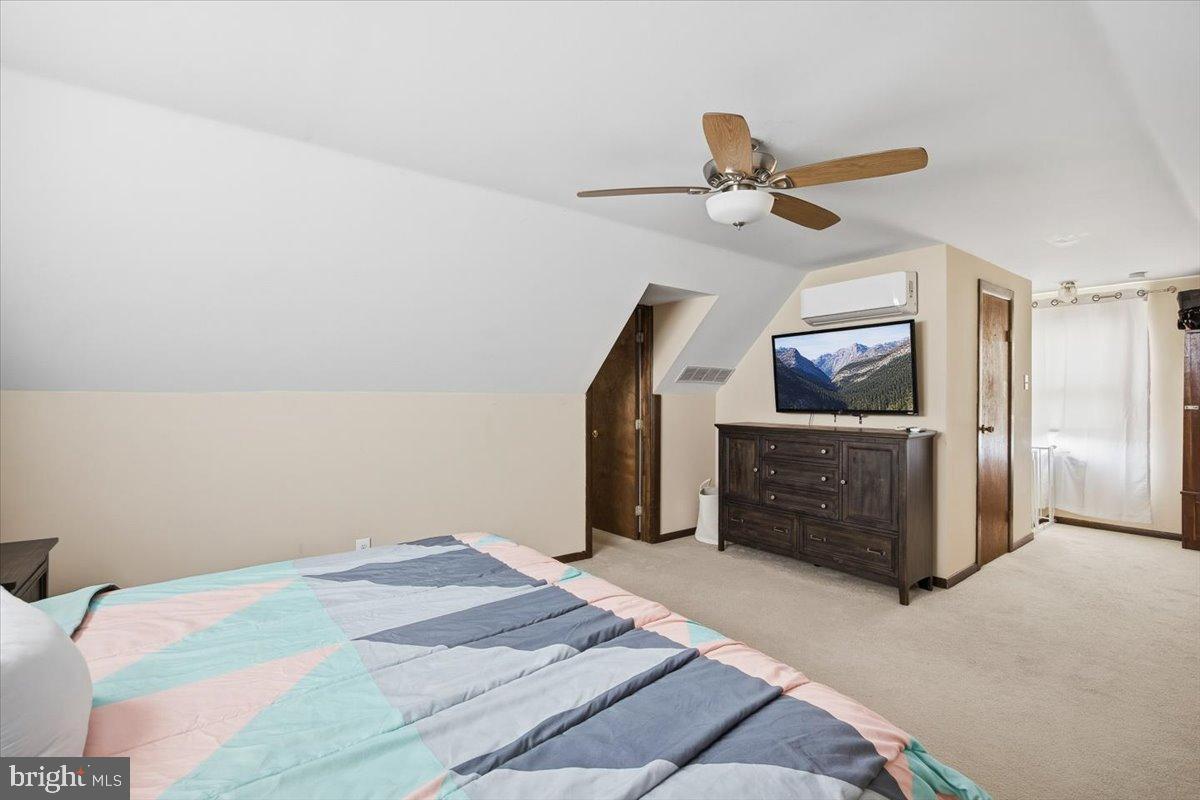 1518 Commissioners Road Mullica Hill, NJ 08062 - Photo 26 of 35 a bedroom with a bed and a flat screen tv