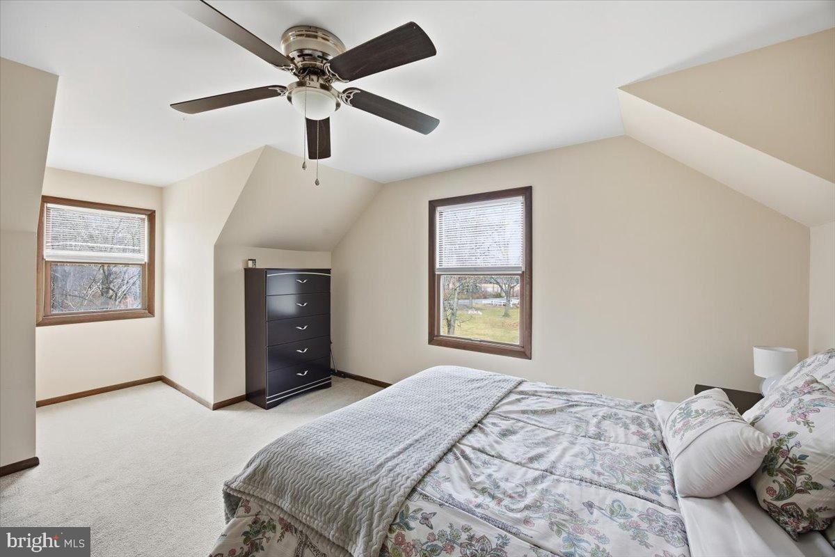 1518 Commissioners Road Mullica Hill, NJ 08062 - Photo 31 of 35 a bedroom with a bed chandelier and a window