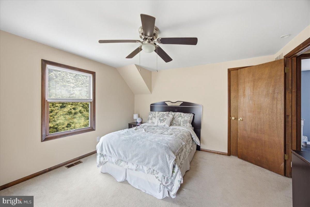 1518 Commissioners Road Mullica Hill, NJ 08062 - Photo 32 of 35 a bedroom with a bed and a window