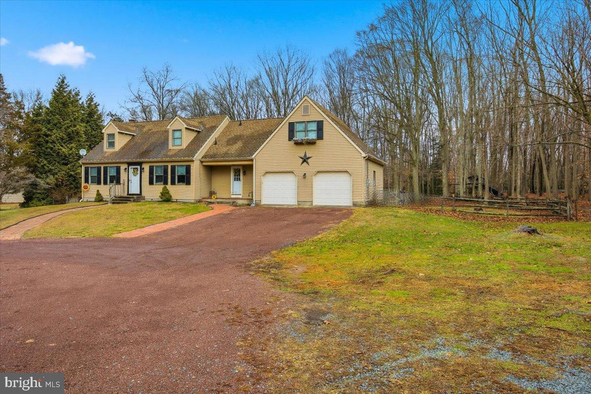 1518 Commissioners Road Mullica Hill, NJ 08062 - Photo 4 of 35 a front view of a house with a yard and trees