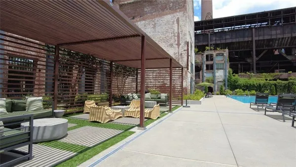 a view of a building with sitting area