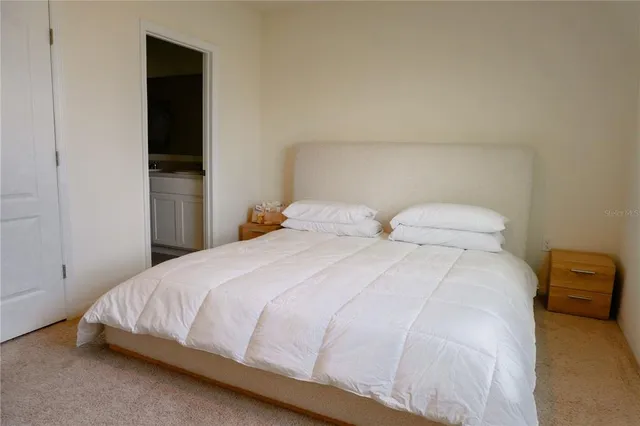 a bathroom with a double vanity sink toilet and shower