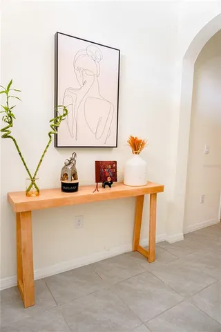 a vase of flowers sitting on a floor