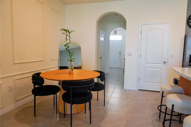 a kitchen with stainless steel appliances granite countertop a stove a sink a refrigerator and a microwave