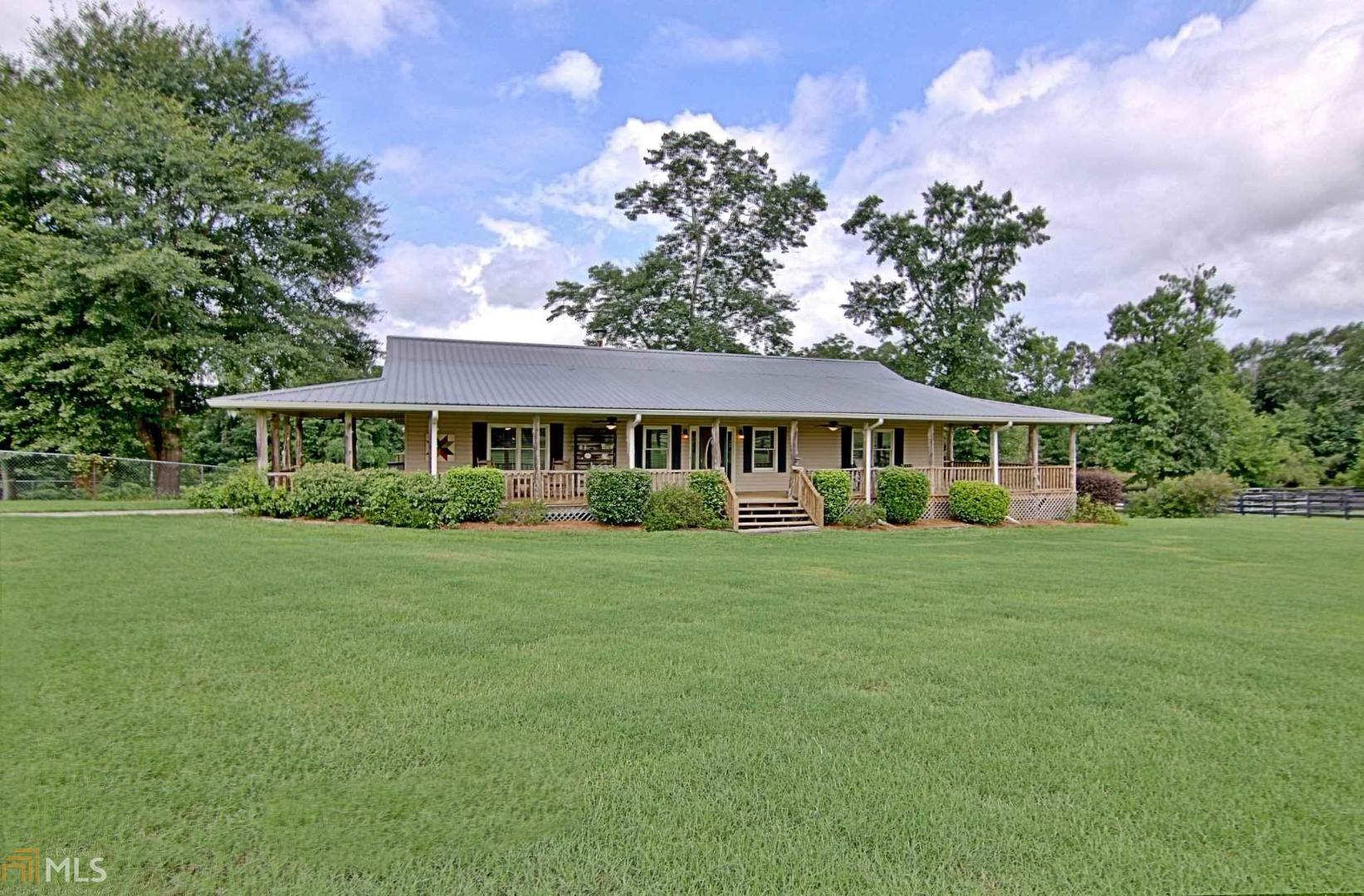 1483 Line Creek Road Brooks, GA 30205 - Photo 1 of 1 a front view of a house with a garden