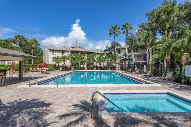 a view of a swimming pool with chairs