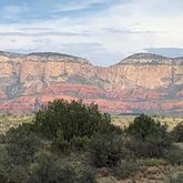 a view of a lake in middle of the forest