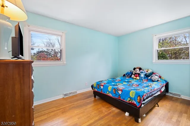 a bed room with a bed and a window