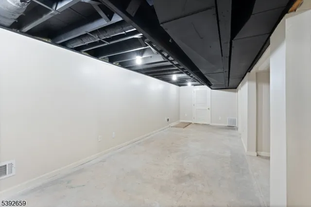 a view of a roof deck with table and chairs a barbeque with wooden floor and fence