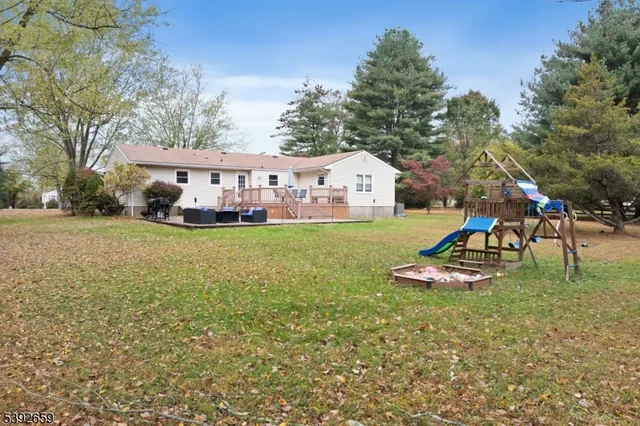 a view of outdoor space with garden and trees