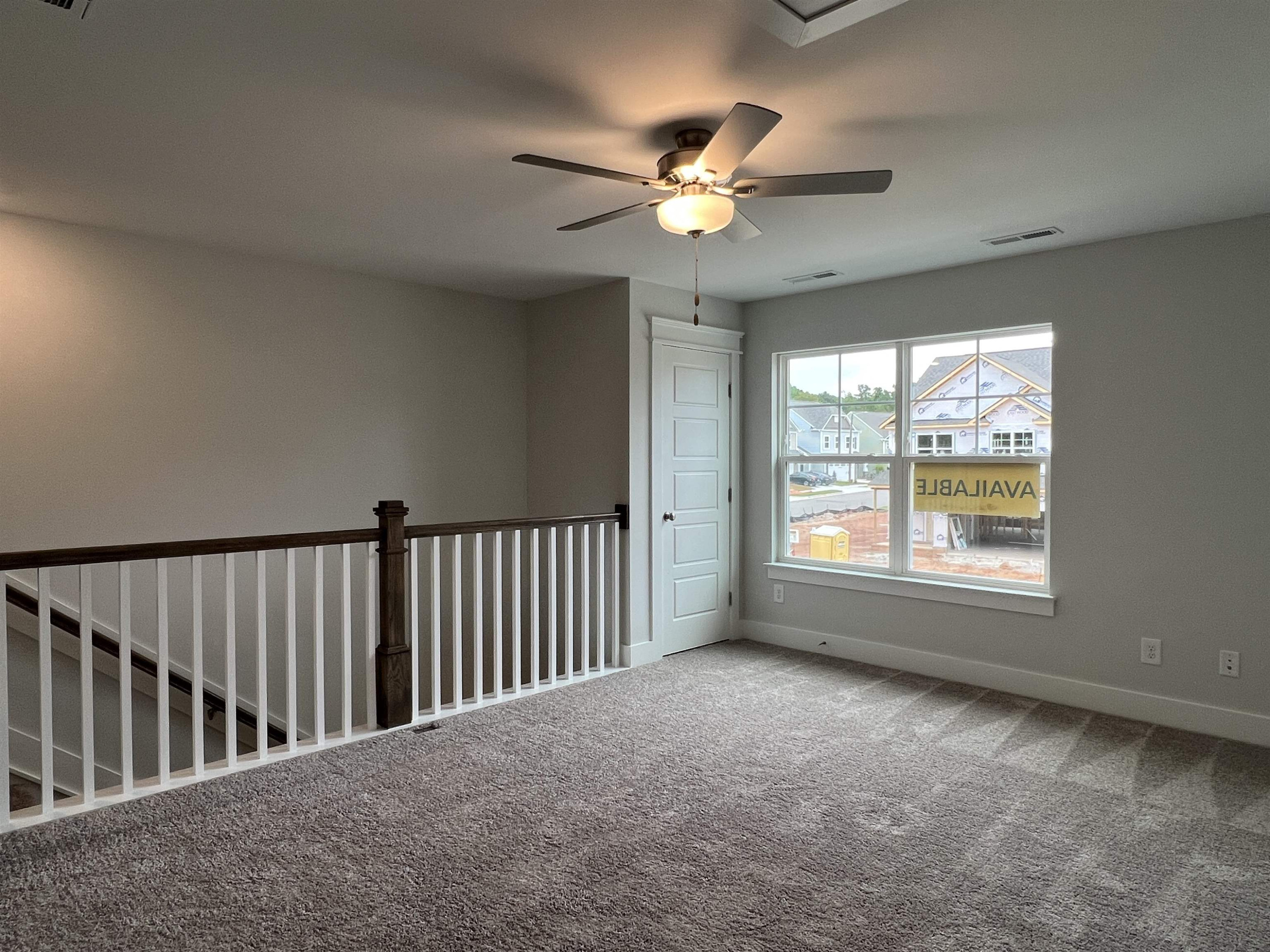 2209 Seneca Road Raleigh, NC 27604 - Photo 10 of 21 a view of an empty room with a window