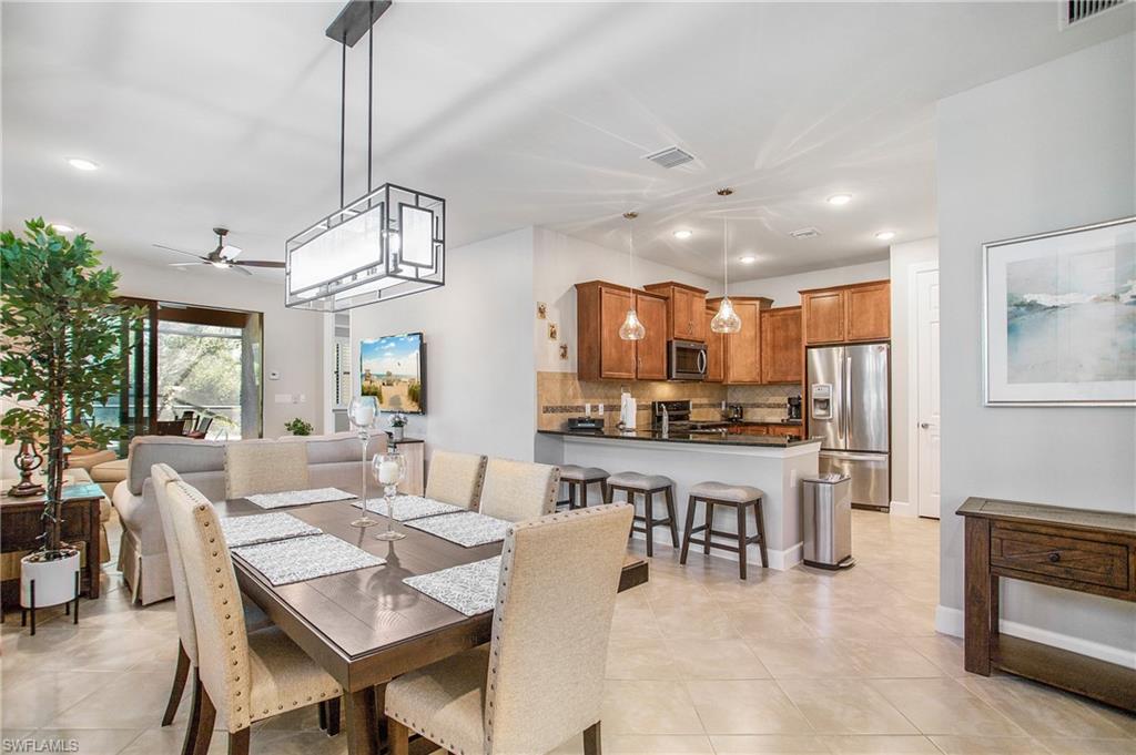 7674 Jacaranda Lane Naples, FL 34114 - Photo 5 of 45 a view of a dining room and livingroom view