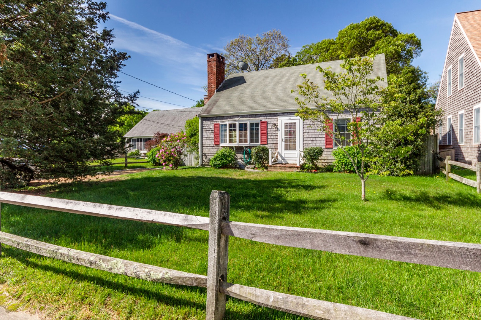 60 Pinehurst Road Edgartown, MA 02539 - Photo 2 of 25 a view of a big house with a big yard plants and large trees