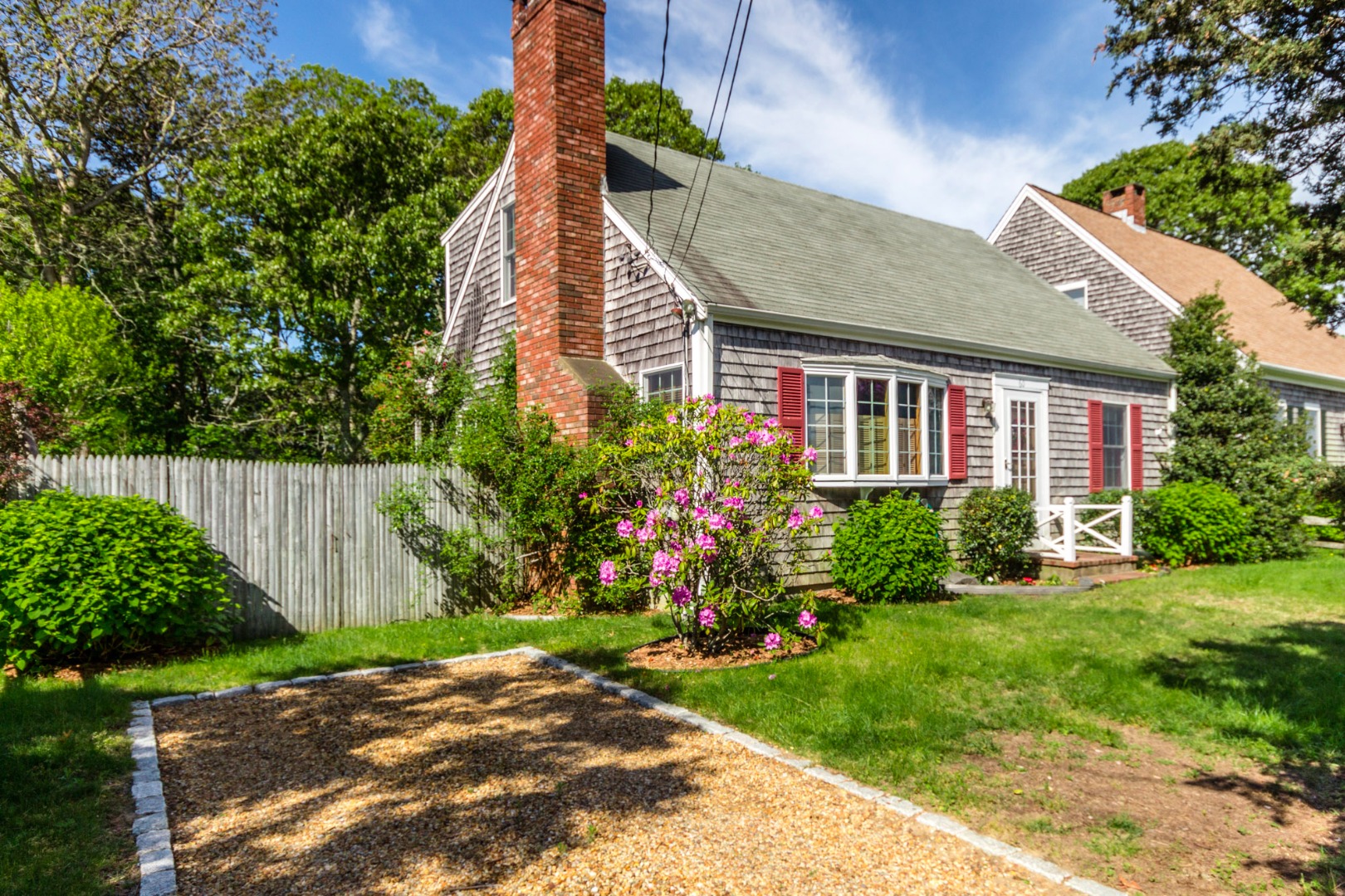 60 Pinehurst Road Edgartown, MA 02539 - Photo 3 of 25 a backyard of a house with lots of green space