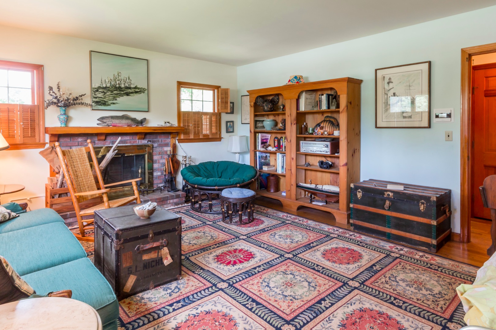 60 Pinehurst Road Edgartown, MA 02539 - Photo 5 of 25 a living room with furniture a rug and a bookshelf