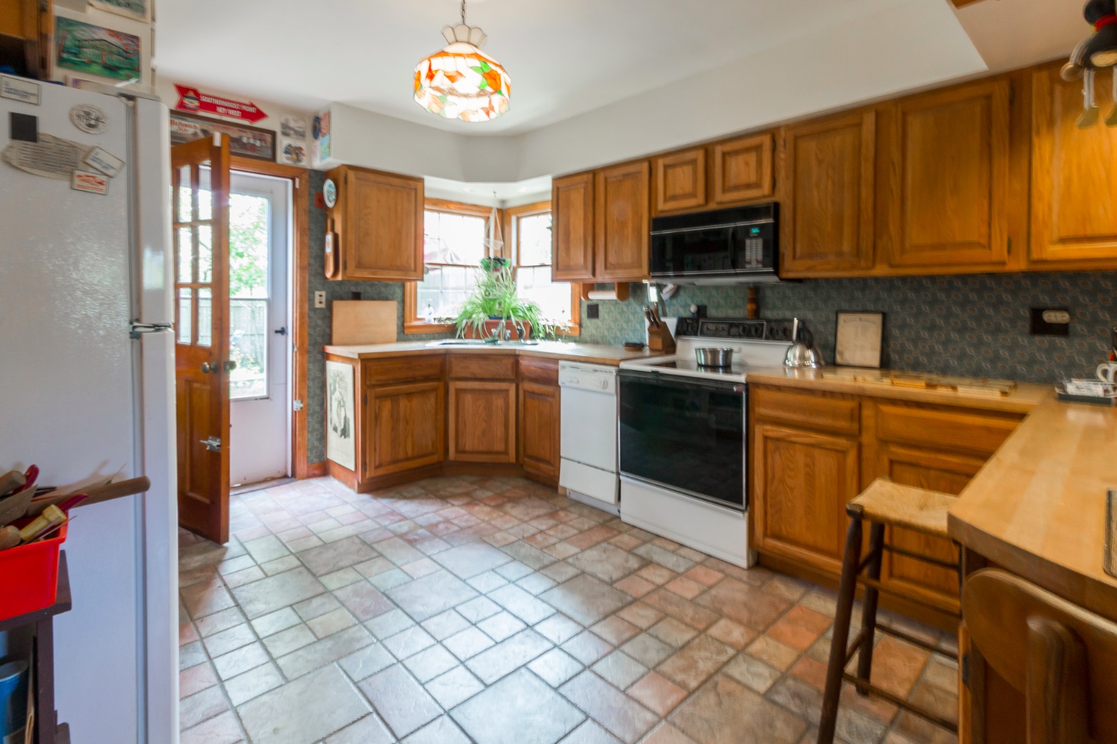 60 Pinehurst Road Edgartown, MA 02539 - Photo 10 of 25 a kitchen with stainless steel appliances granite countertop a stove top oven a sink dishwasher and a refrigerator with cabinets