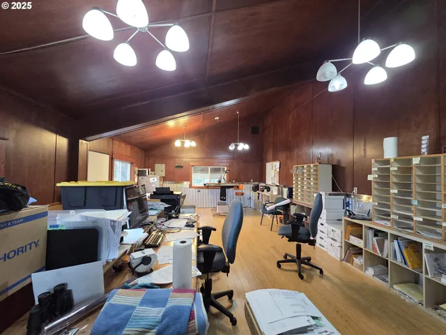 a view of a workspace with furniture and a workspace