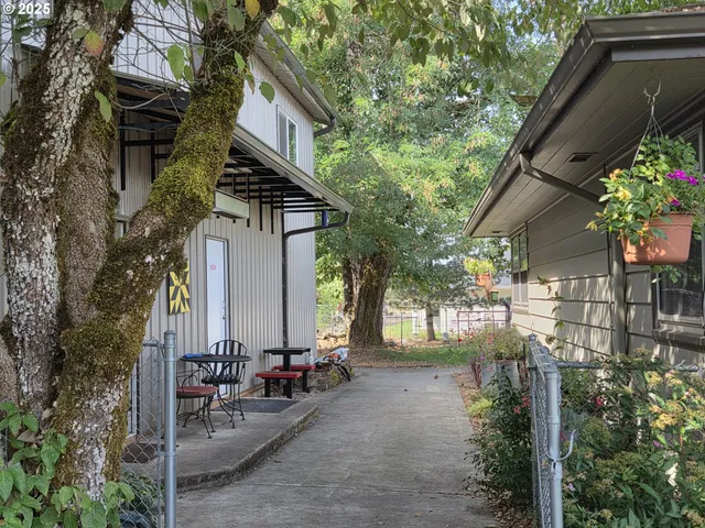a backyard of a house with lots of green space