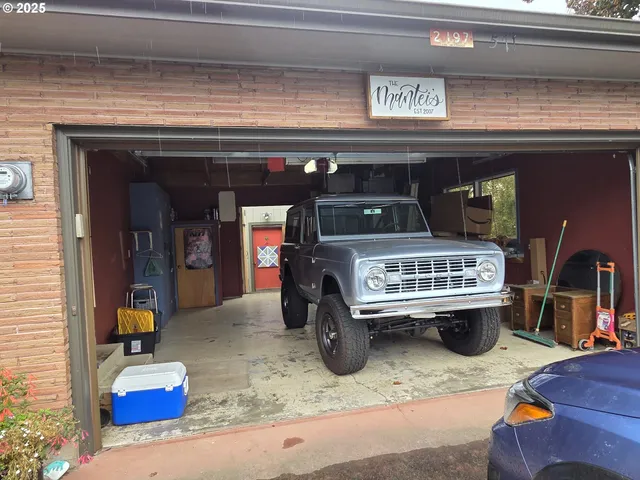 a utility room with furniture and a fireplace