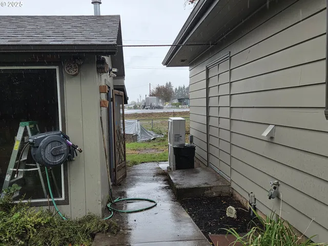 a big yard with lots of green space and plants