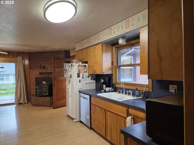 a view of a livingroom with furniture and a fireplace