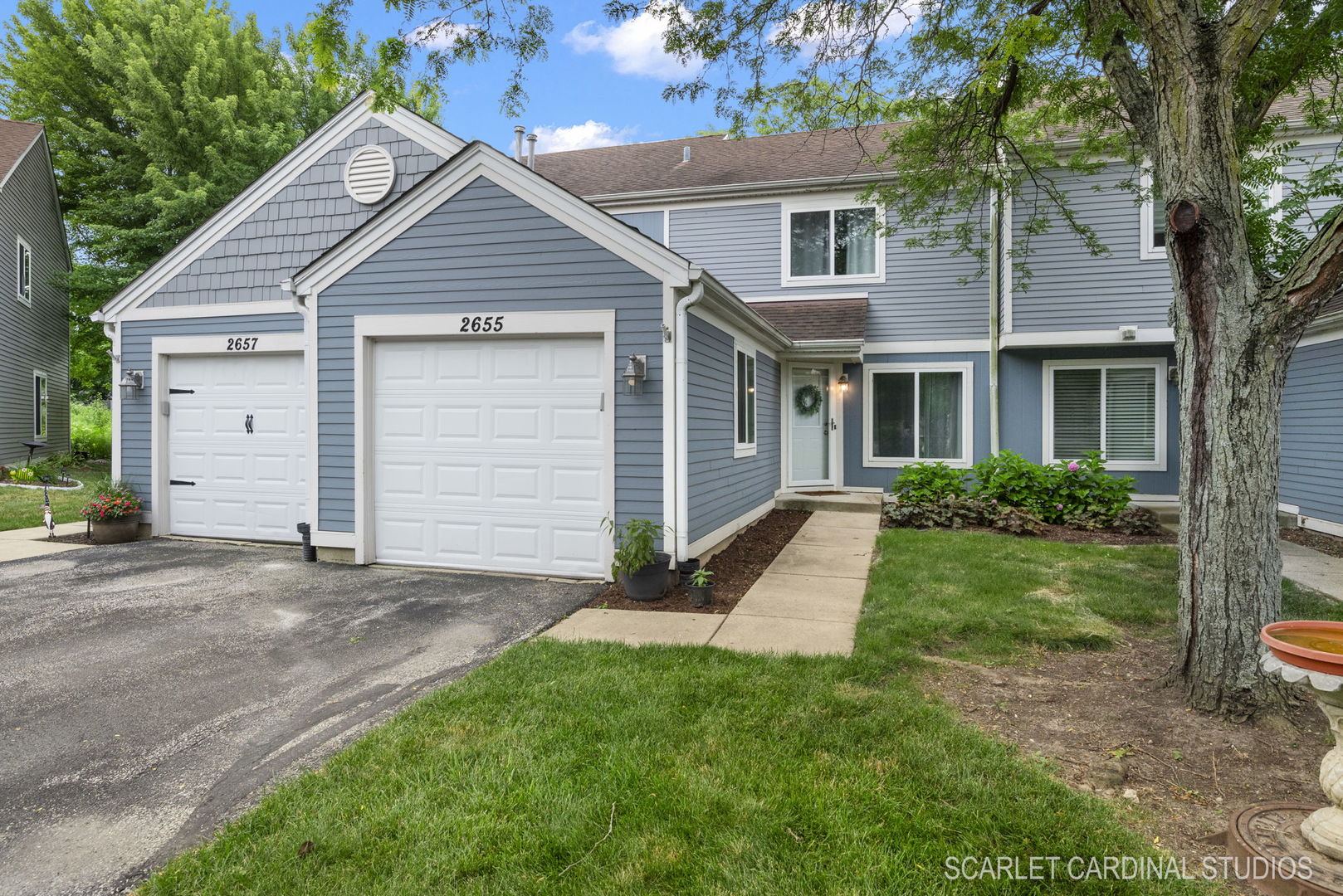 2655 Prairieview Lane South Aurora, IL 60502 - Photo 1 of 13 a front view of a house with a yard and garage