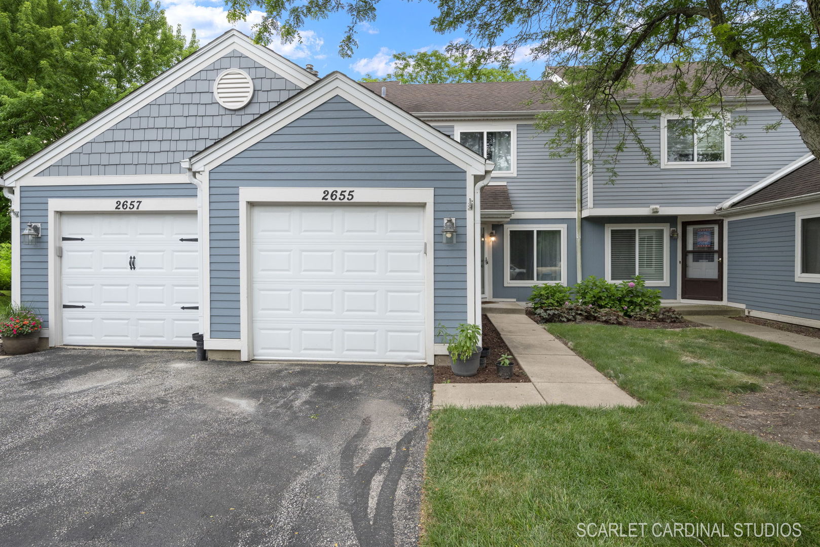 2655 Prairieview Lane South Aurora, IL 60502 - Photo 13 of 13 a front view of a house with a yard and garage