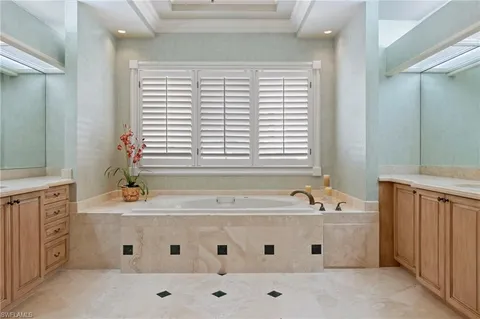 a bathroom with a bathtub and a sink