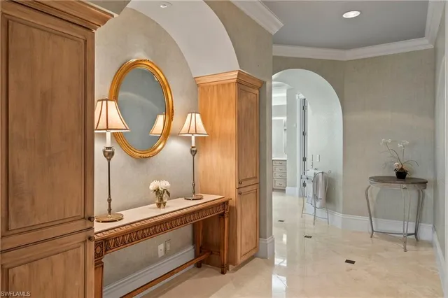 a room with a mirror a sink and a mirror