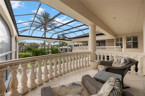 a view of a house with swimming pool and porch
