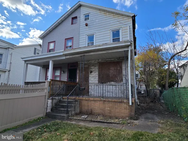 a front view of a house with garage