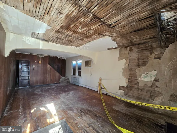 a view of a room with wooden floor