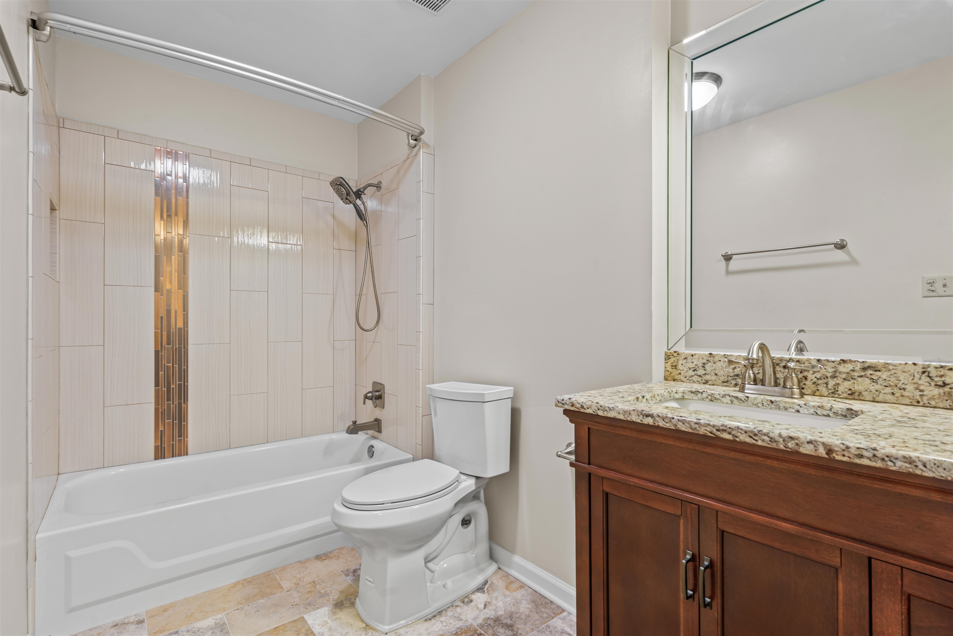 7087 Cutter Mill Road Memphis, TN 38141 - Photo 10 of 20 Fully renovated bathroom featuring toilet, vanity, and tiled shower.