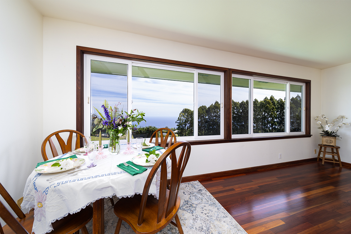 35-486 Pahale Road Papaaloa, HI 96780 - Photo 12 of 30 a dining room with furniture potted plants and wooden floor