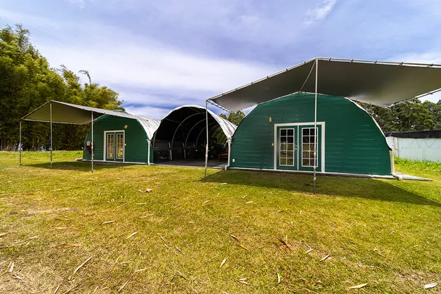 a view of a house with backyard and swimming pool