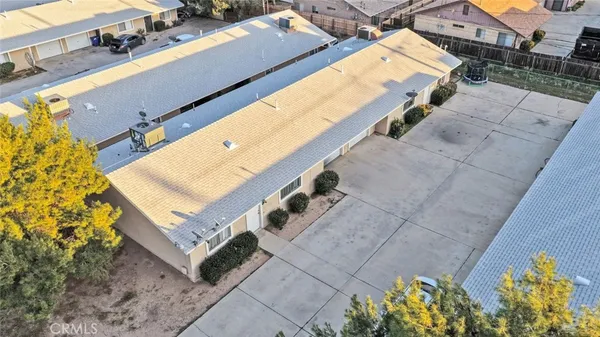 an aerial view of residential house with outdoor space and swimming pool