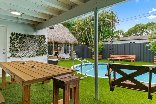 a view of an outdoor sitting area with furniture