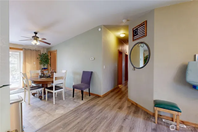 a view of a dining room with furniture and wooden floor