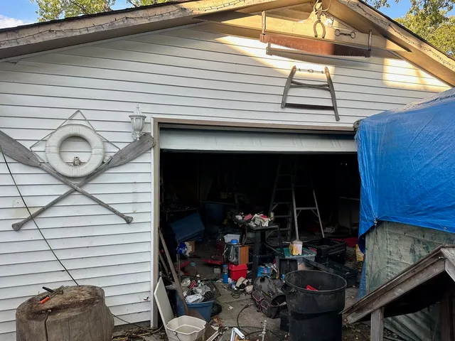 a view of a chairs and table in the back yard of the house