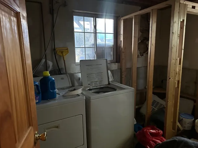 a bedroom with furniture and a flat screen tv