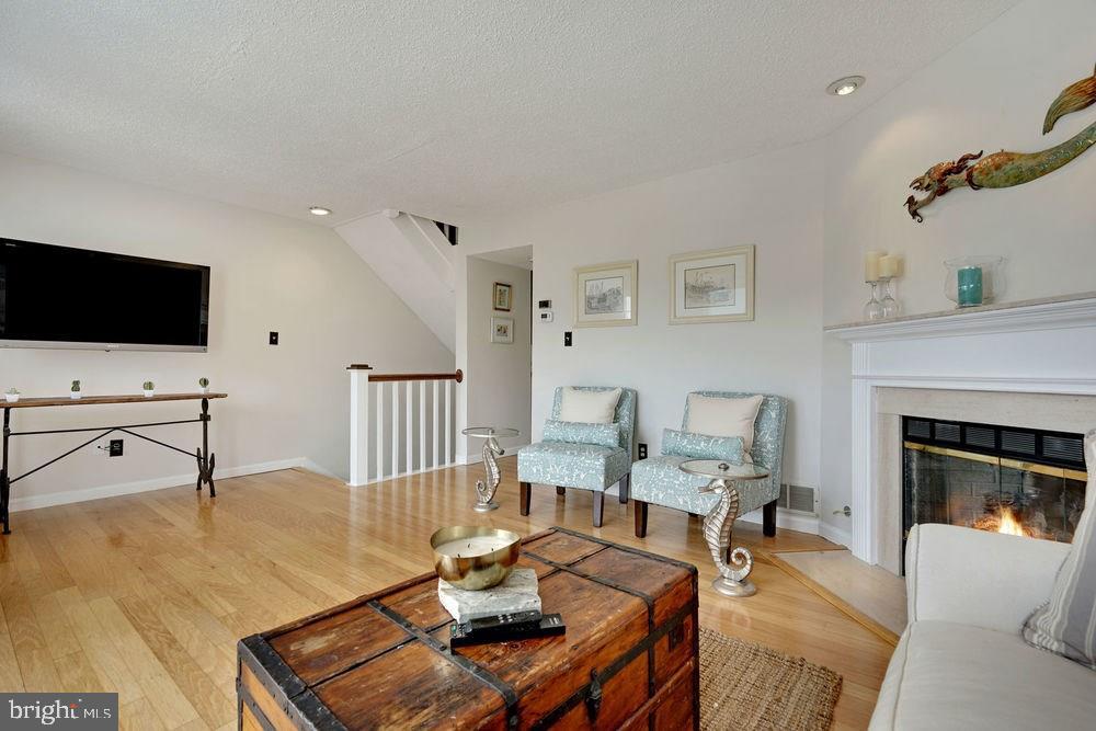 358 Captains Walk, Unit 58 Forked River, NJ 08731 - Photo 21 of 43 a living room with furniture and a flat screen tv