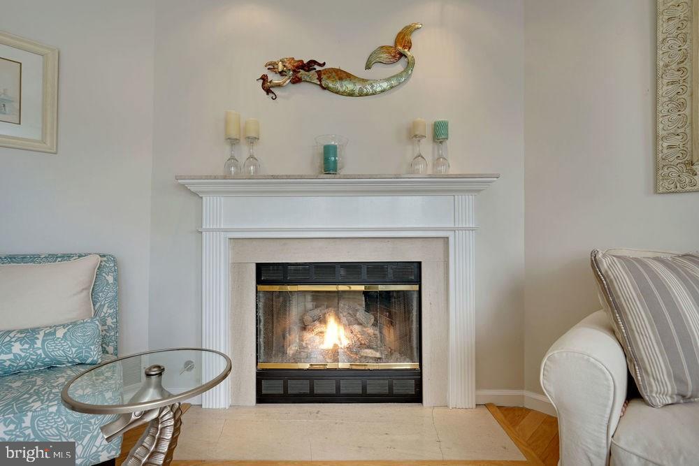 358 Captains Walk, Unit 58 Forked River, NJ 08731 - Photo 22 of 43 a living room with furniture and a fireplace