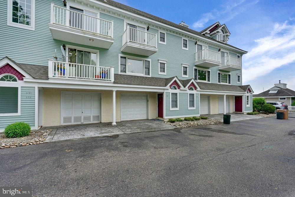 358 Captains Walk, Unit 58 Forked River, NJ 08731 - Photo 5 of 43 a front view of a building