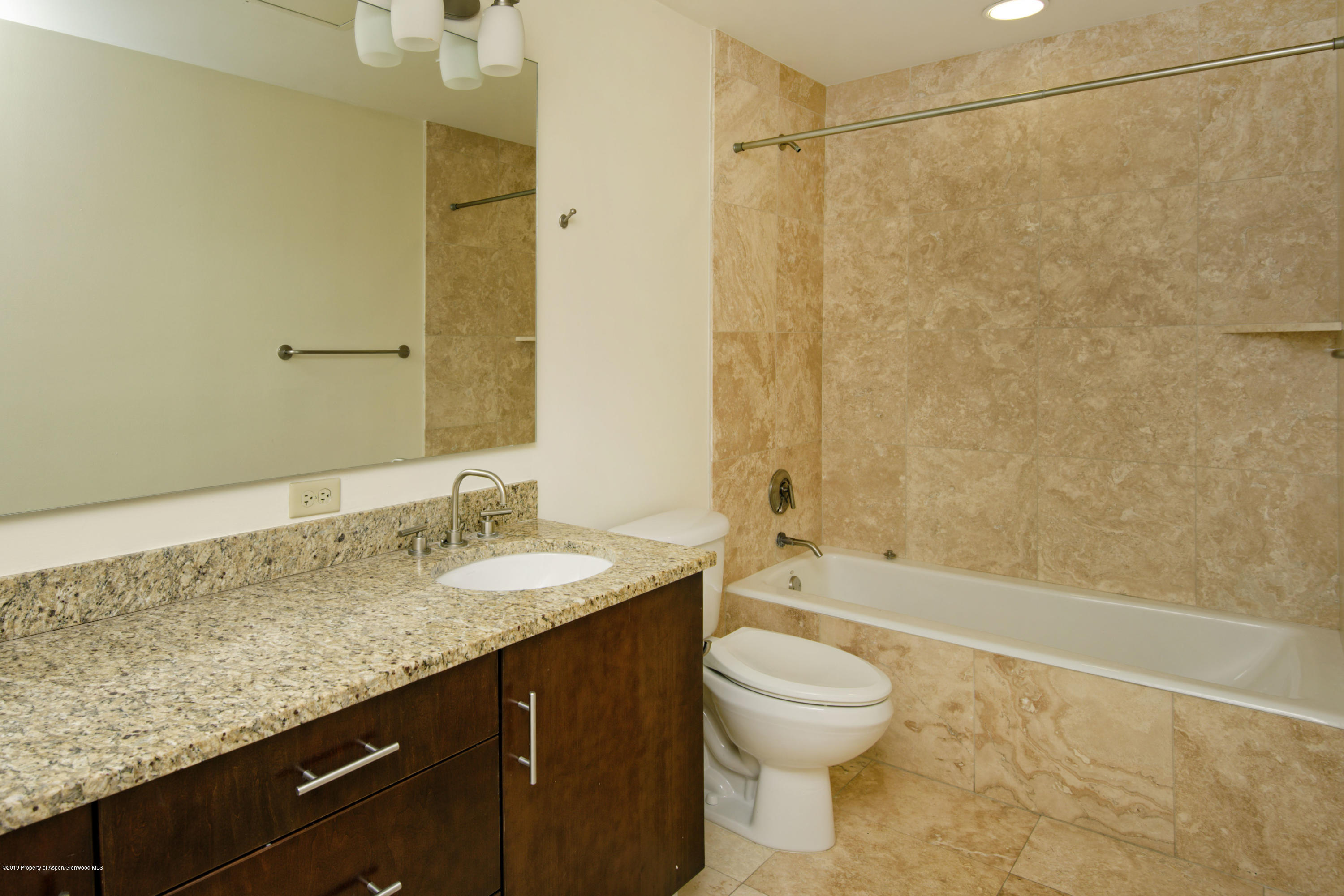 361 Robinson Street, Unit 202 Basalt, CO 81621 - Photo 17 of 29 a bathroom with a granite countertop sink a toilet and shower