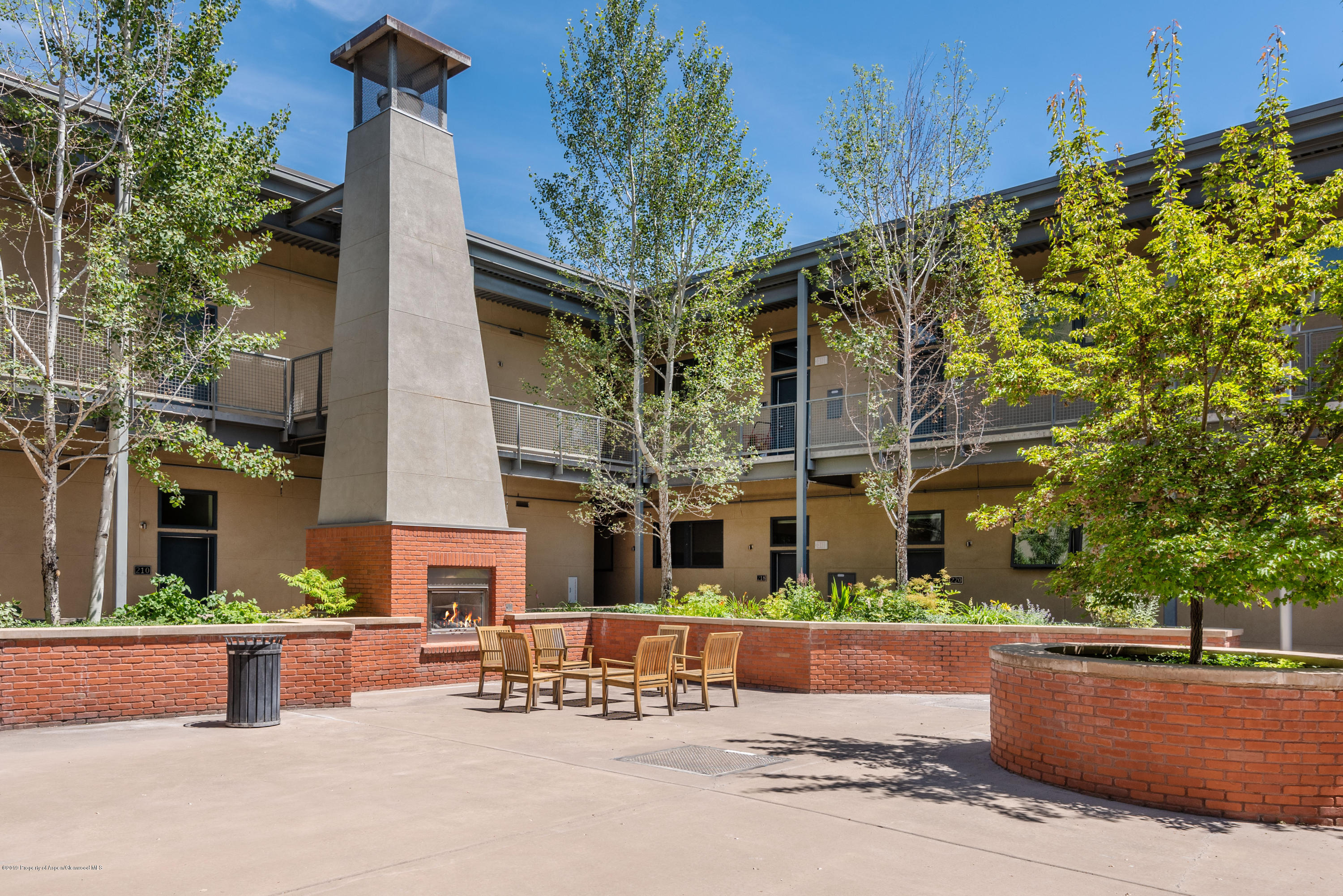 361 Robinson Street, Unit 202 Basalt, CO 81621 - Photo 21 of 29 a view of a building with large tree in front of it