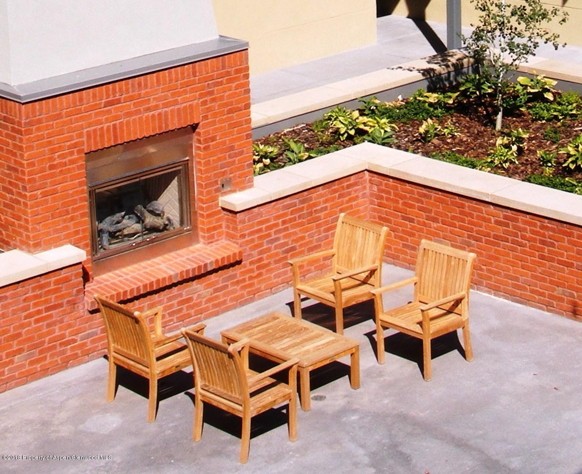 361 Robinson Street, Unit 202 Basalt, CO 81621 - Photo 24 of 29 a balcony with a table and chairs
