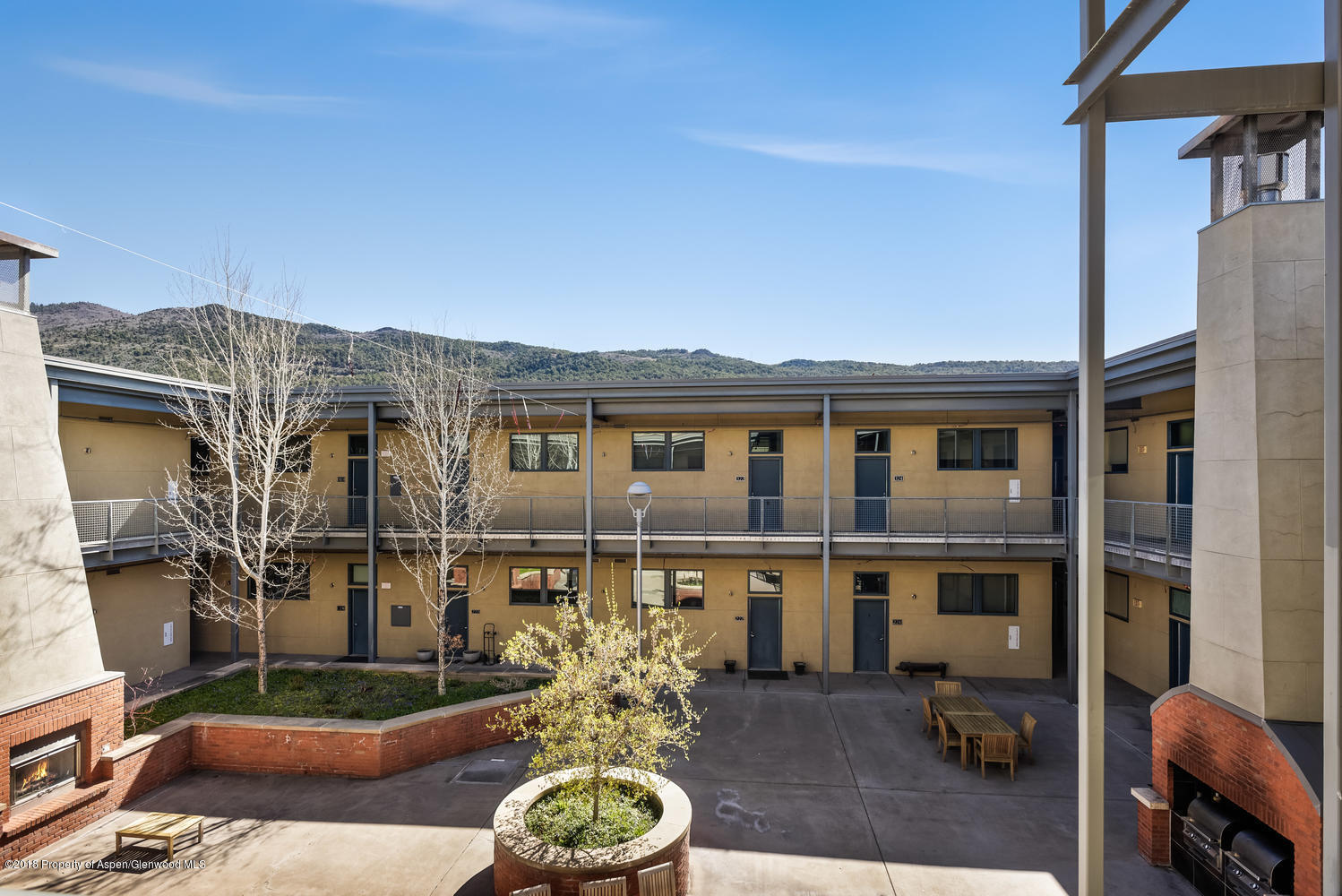 361 Robinson Street, Unit 202 Basalt, CO 81621 - Photo 25 of 29 a front view of a house with outdoor seating