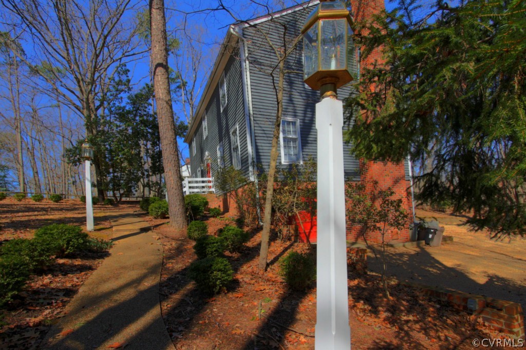 12420 Robious Road Midlothian, VA 23113 - Photo 6 of 16 a view of a street with large trees