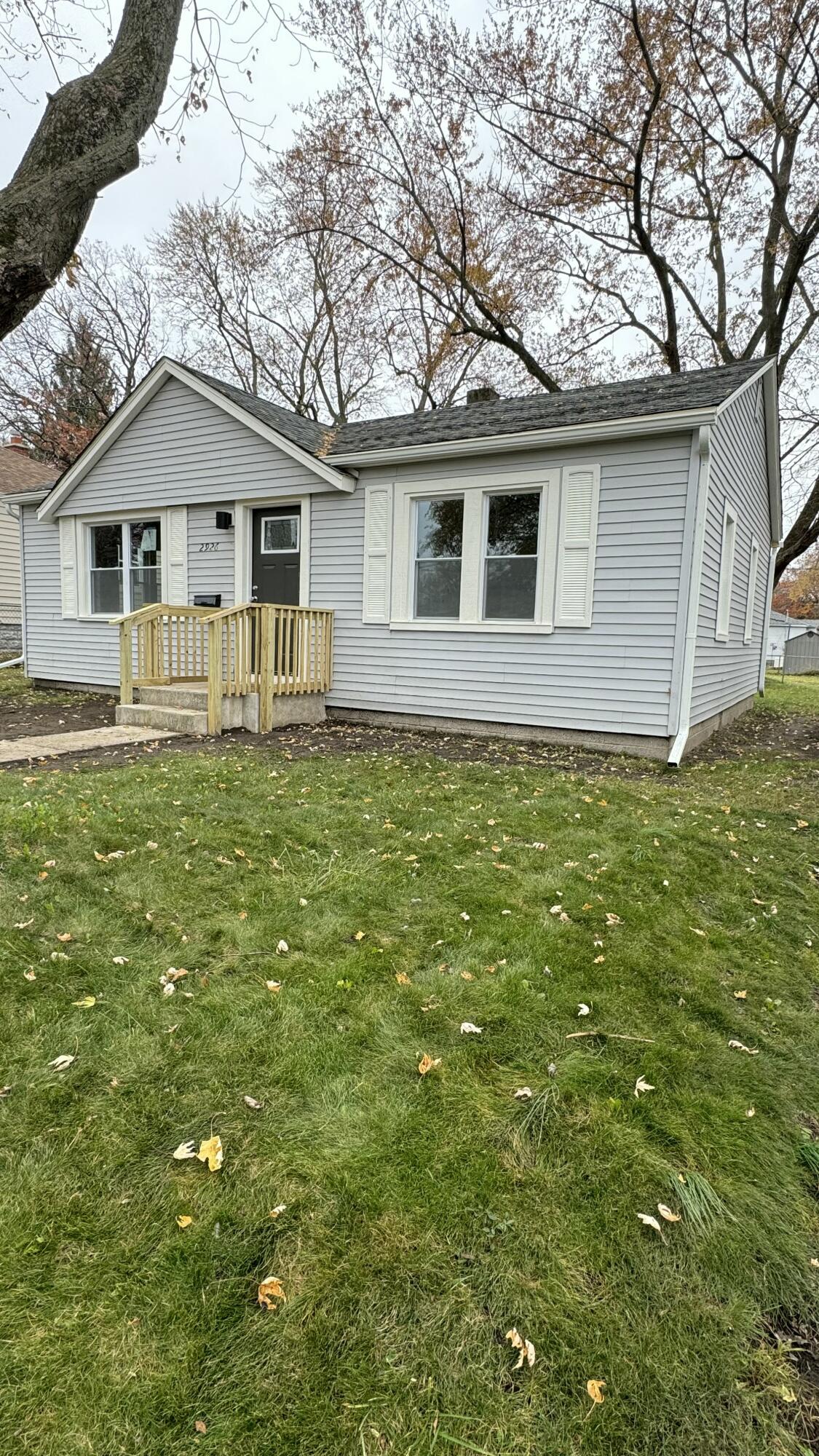 2926 State Street Lake Station, IN 46405 - Photo 1 of 16 a house that has a tree in it